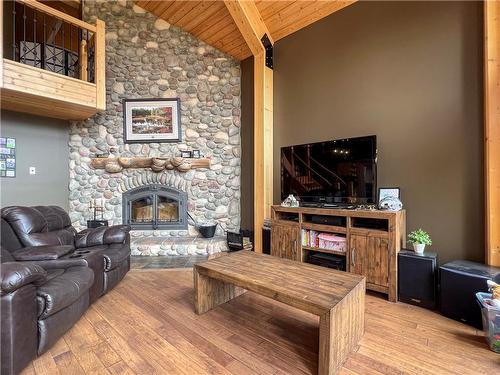 129 South Bay Drive, Onanole, MB - Indoor Photo Showing Living Room With Fireplace