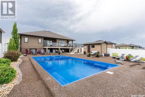 415 Palmer Crescent, Warman, SK - Outdoor With In Ground Pool With Deck Patio Veranda With Backyard With Exterior