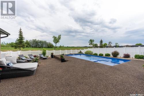 415 Palmer Crescent, Warman, SK - Outdoor With In Ground Pool With Backyard