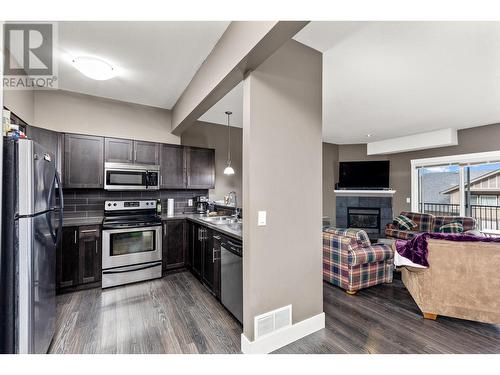 995 Mt. Ida Drive Unit# 3, Vernon, BC - Indoor Photo Showing Kitchen With Fireplace