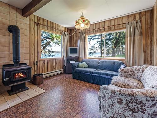 970 Sea Fern Lane, Mudge Island, BC - Indoor Photo Showing Living Room With Fireplace