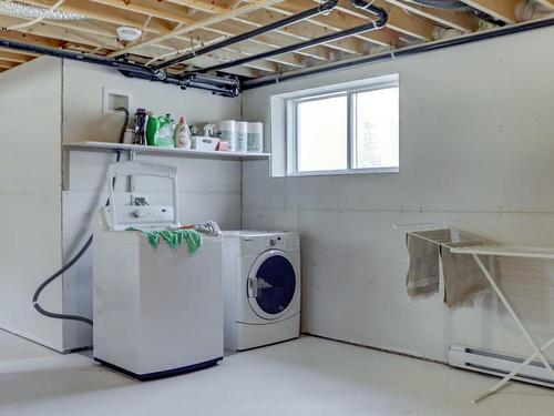 Basement - 96 111E Avenue, Saint-Hippolyte, QC - Indoor Photo Showing Laundry Room