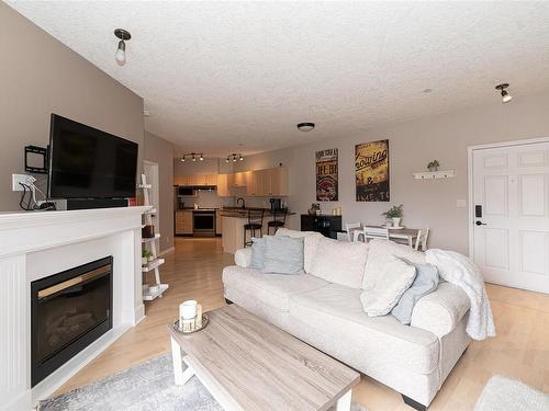 308-893 Hockley Ave, Langford, BC - Indoor Photo Showing Living Room With Fireplace