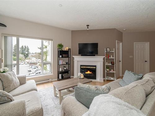 308-893 Hockley Ave, Langford, BC - Indoor Photo Showing Living Room With Fireplace