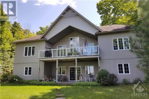 Rear elevation showing the walkout lower level - 154 Bluff Point Drive, Calabogie, ON - Outdoor With Deck Patio Veranda