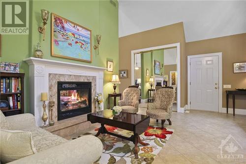 Cozy front sitting area - 154 Bluff Point Drive, Calabogie, ON - Indoor Photo Showing Living Room With Fireplace