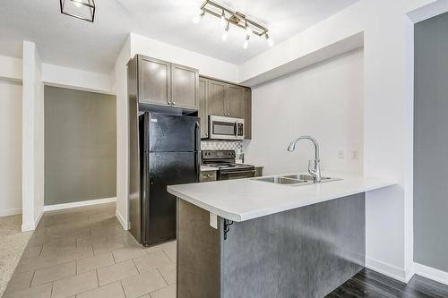85 Robinson Street|Unit #209, Hamilton, ON - Indoor Photo Showing Kitchen With Double Sink
