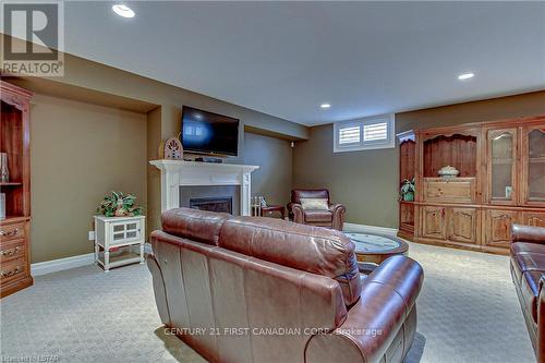17 - 725 Eagletrace Drive, London, ON - Indoor Photo Showing Basement With Fireplace