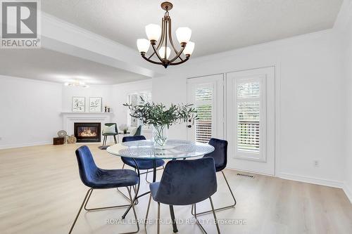 #44 -410 Ambleside Dr, London, ON - Indoor Photo Showing Dining Room With Fireplace