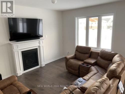 203 Brownley Lane, Essa, ON - Indoor Photo Showing Living Room With Fireplace