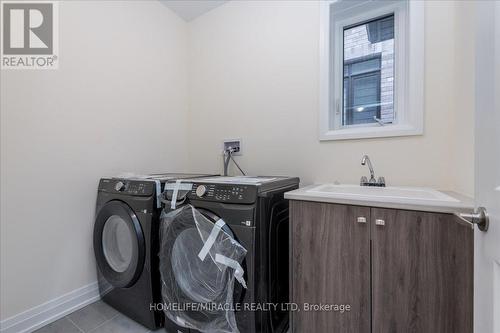 32 Daisy Street, Springwater, ON - Indoor Photo Showing Laundry Room