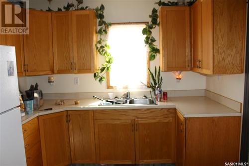 834 6Th Avenue Nw, Moose Jaw, SK - Indoor Photo Showing Kitchen With Double Sink