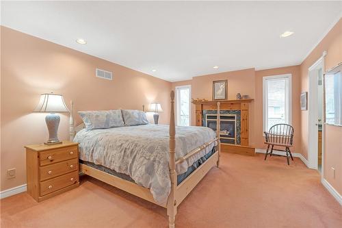 238 Alderlea Avenue, Mount Hope, ON - Indoor Photo Showing Bedroom With Fireplace