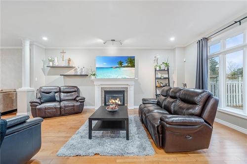 virtually staged - 152 Central Avenue, Grimsby, ON - Indoor Photo Showing Living Room With Fireplace