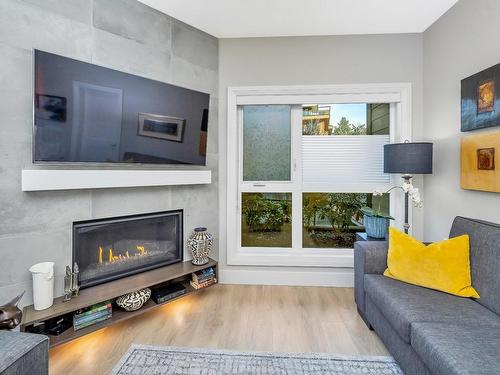 102-741 Travino Lane, Saanich, BC - Indoor Photo Showing Living Room With Fireplace