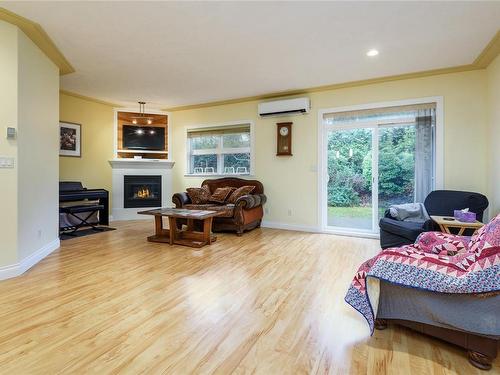 11-1285 Guthrie Rd, Comox, BC - Indoor Photo Showing Other Room With Fireplace