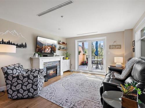 523-1400 Lynburne Pl, Langford, BC - Indoor Photo Showing Living Room With Fireplace