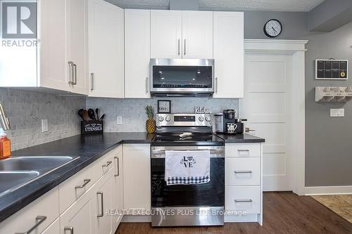 14 Page Street, St. Catharines, ON - Indoor Photo Showing Kitchen With Double Sink