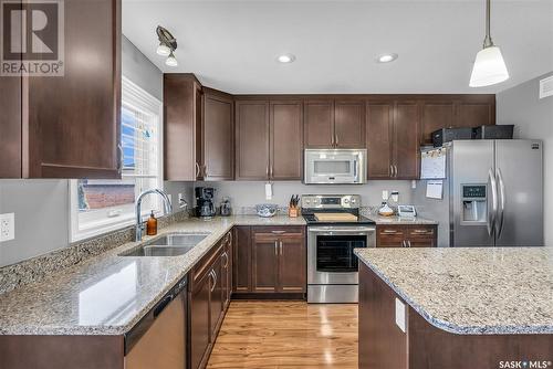 738 Stonebridge Common, Saskatoon, SK - Indoor Photo Showing Kitchen With Stainless Steel Kitchen With Double Sink