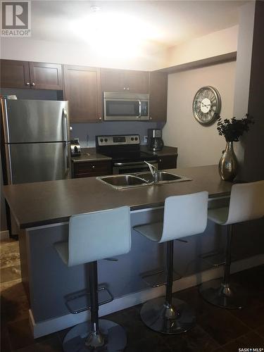 205 820 5Th Street Ne, Weyburn, SK - Indoor Photo Showing Kitchen With Double Sink