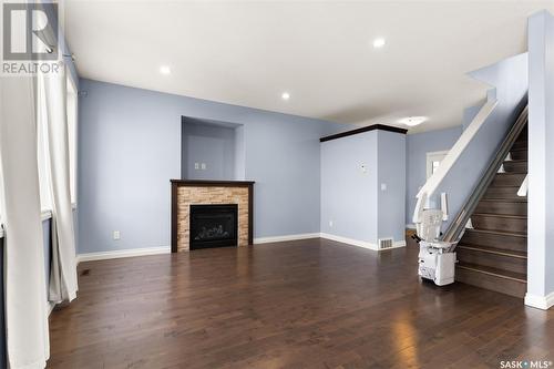 4460 Delhaye Way, Regina, SK - Indoor Photo Showing Living Room With Fireplace