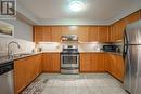 #110 -50 Mulligan Lane, Wasaga Beach, ON  - Indoor Photo Showing Kitchen With Double Sink 