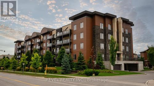 #206 -100 Dean Ave, Barrie, ON - Outdoor With Balcony With Facade
