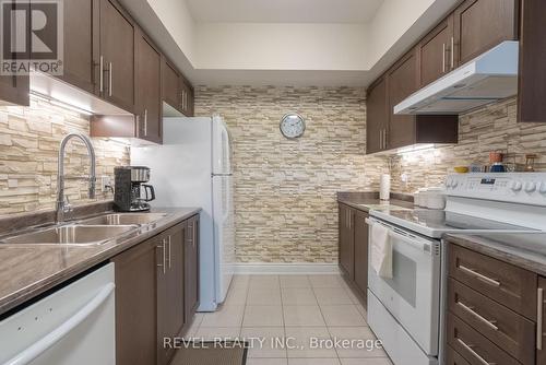 #206 -100 Dean Ave, Barrie, ON - Indoor Photo Showing Kitchen With Double Sink