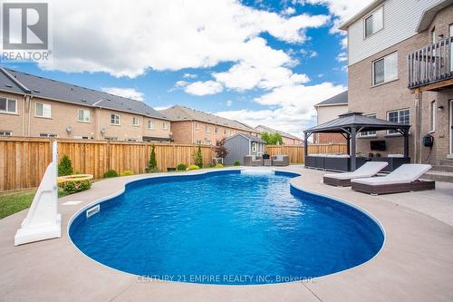 560 Sanderson Cres, Milton, ON - Outdoor With In Ground Pool With Backyard