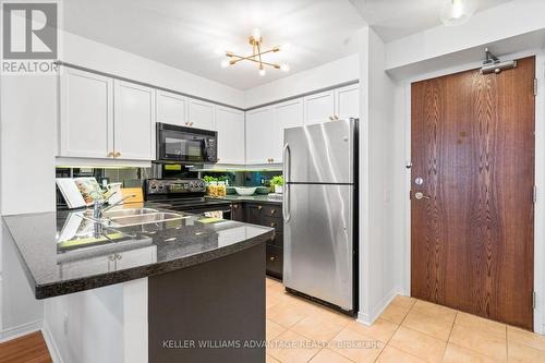 #214 -1863 Queen St E, Toronto, ON - Indoor Photo Showing Kitchen With Double Sink