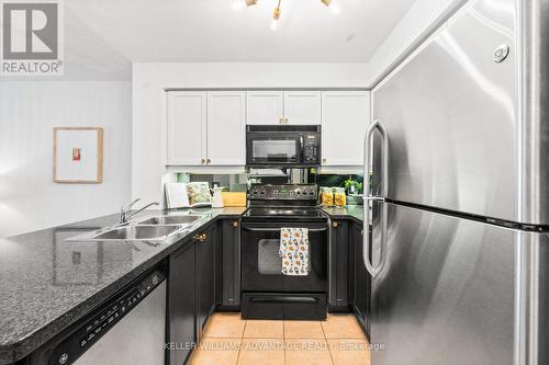 #214 -1863 Queen St E, Toronto, ON - Indoor Photo Showing Kitchen With Double Sink