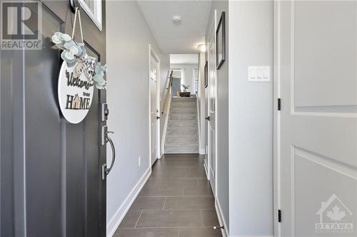 Explore this modern home's elegant foyer, featuring sleek, easy-to-maintain tile flooring that combines style with practicality for prospective buyers. - 10 Whitcomb Crescent, Smiths Falls, ON - Indoor Photo Showing Other Room