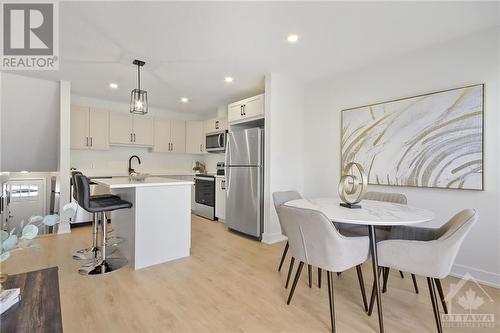 Enjoy a kitchen island with an eat-up bar, perfect for savoring morning coffees and breakfasts, all illuminated by plenty of flowing natural light. - 10 Whitcomb Crescent, Smiths Falls, ON - Indoor