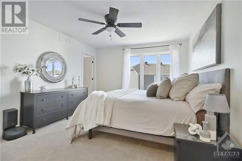 Primary bedroom with en-suite, carpeted flooring and lots of natural flowing sunlight. - 10 Whitcomb Crescent, Smiths Falls, ON - Indoor Photo Showing Bedroom