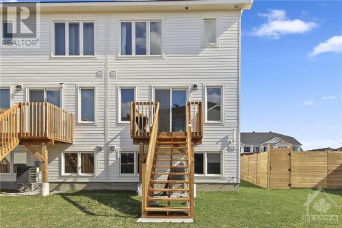 Expansive backyard featuring a deck, and the backyard is perfect for entertaining and play. - 10 Whitcomb Crescent, Smiths Falls, ON - Outdoor With Facade