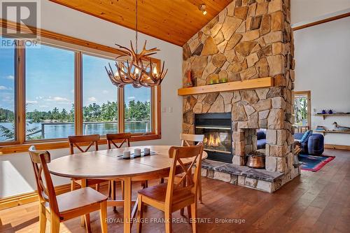 484 Juniper Island 18, Douro-Dummer, ON - Indoor Photo Showing Dining Room With Fireplace