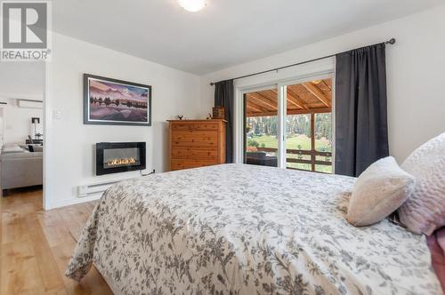 20245 Garnet Valley Road, Summerland, BC - Indoor Photo Showing Bedroom With Fireplace