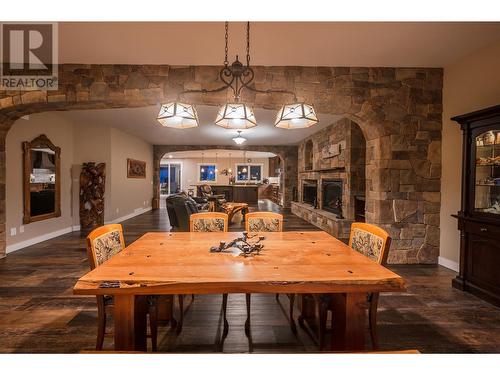 1505 Britton Road, Summerland, BC - Indoor Photo Showing Dining Room With Fireplace