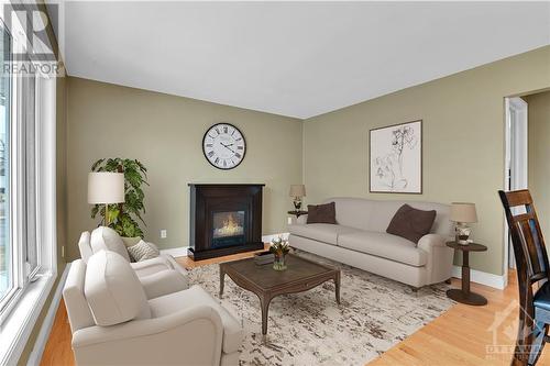 Living Space (Virtually Staged) - 2 Welland Street, Perth, ON - Indoor Photo Showing Living Room With Fireplace