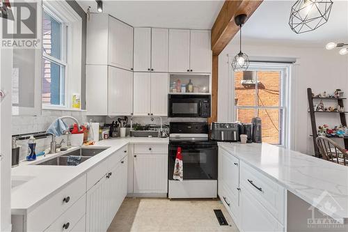 Unit #1 - Updated Kitchen - 128 Flora Street, Ottawa, ON - Indoor Photo Showing Kitchen With Double Sink
