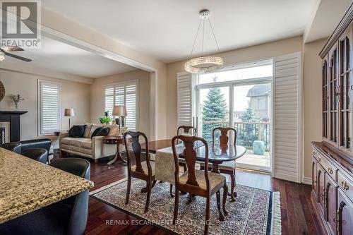 71 Oakhaven Pl, Hamilton, ON - Indoor Photo Showing Dining Room With Fireplace