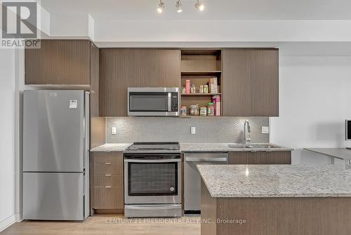 #710 -4655 Glen Erin Dr, Mississauga, ON - Indoor Photo Showing Kitchen With Upgraded Kitchen