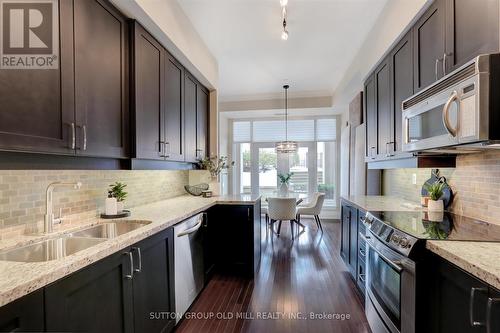 101 - 9 Burnhamthorpe Crescent, Toronto, ON - Indoor Photo Showing Kitchen With Double Sink With Upgraded Kitchen