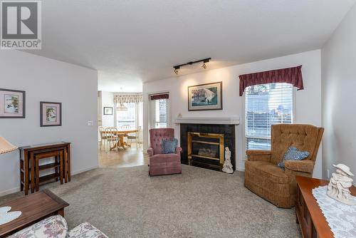 108 7650 St Patrick Avenue, Prince George, BC - Indoor Photo Showing Living Room With Fireplace