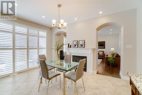 498 Wettlaufer Terrace, Milton, ON - Indoor Photo Showing Dining Room With Fireplace