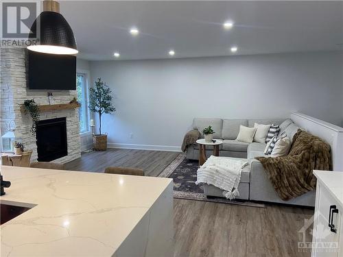 Living room - 432 John Aselford Drive, Kanata, ON - Indoor With Fireplace