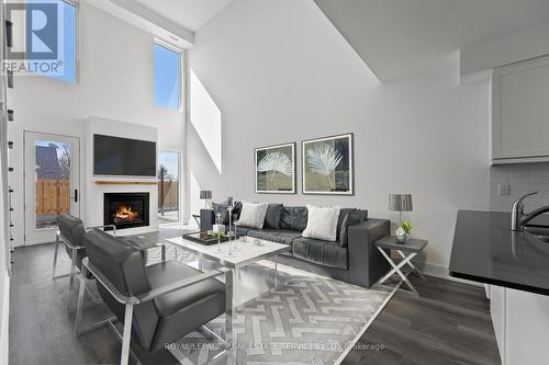 #2 -19 West St N, Kawartha Lakes, ON - Indoor Photo Showing Living Room With Fireplace