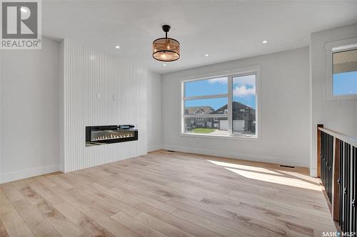 810 Weir Crescent, Warman, SK - Indoor Photo Showing Other Room With Fireplace