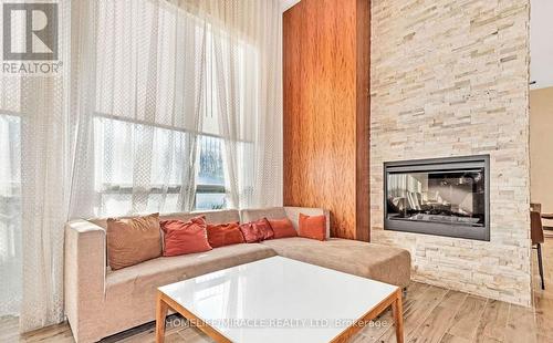 2301 - 50 Town Centre Court, Toronto, ON - Indoor Photo Showing Living Room With Fireplace