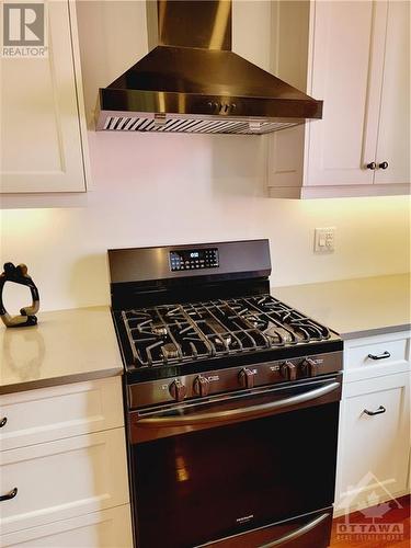 Gas range with hood fan - 653 Bayview Drive, Constance Bay, ON - Indoor Photo Showing Kitchen